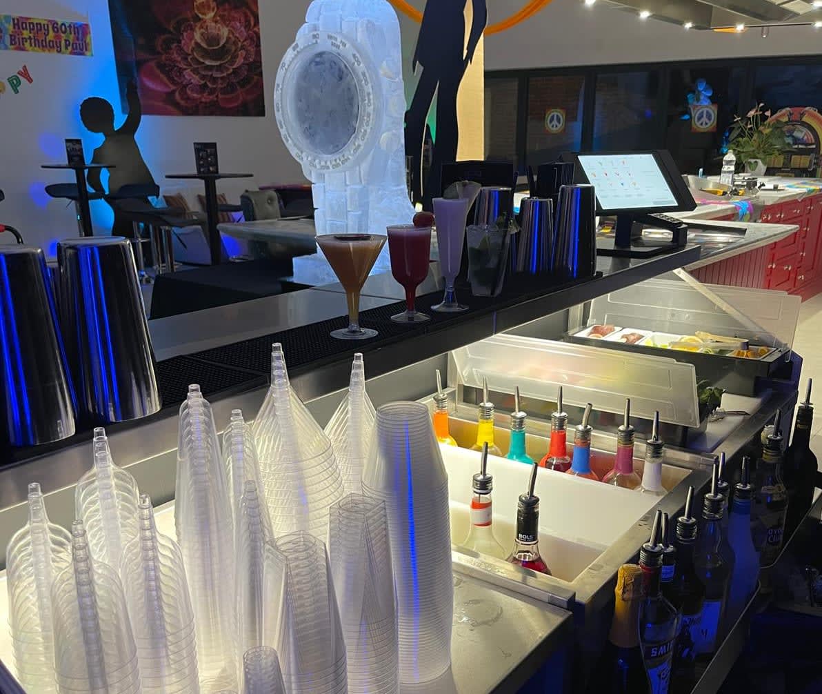 Bartender mixing colours, cultures and cocktails